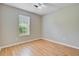 A bright and airy bedroom with neutral paint, wood floors, and a ceiling fan at 405 Amberjack Way, Summerville, SC 29485