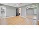 This is a view of a bedroom featuring wood floors, a ceiling fan, and a mirrored closet at 405 Amberjack Way, Summerville, SC 29485
