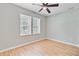 Well lit bedroom with ceiling fan, neutral paint, and hardwood flooring at 405 Amberjack Way, Summerville, SC 29485