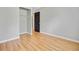 Empty bedroom featuring wood floors, fresh paint, and a convenient closet space at 405 Amberjack Way, Summerville, SC 29485