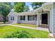 Front exterior featuring well-maintained lawn and landscaping, walkway to the entrance, and neutral color siding at 405 Amberjack Way, Summerville, SC 29485