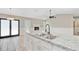 Open concept kitchen with granite counters, stainless sink and view to the fireplace at 405 Amberjack Way, Summerville, SC 29485