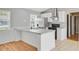 Kitchen with stainless steel appliances, bright windows, and open floor plan at 405 Amberjack Way, Summerville, SC 29485