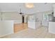Open concept living area featuring hardwood floors, modern kitchen island, and neutral paint at 405 Amberjack Way, Summerville, SC 29485