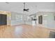 Open-concept space with a modern kitchen, a cozy fireplace, and light-colored wood floors for a bright and airy feel at 405 Amberjack Way, Summerville, SC 29485
