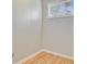 Clean corner room with hardwood floors, neutral paint, and window light at 405 Amberjack Way, Summerville, SC 29485