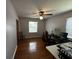 Cozy bedroom with hardwood floors, ceiling fan, natural light, and closet at 409 Azalea Dr, Walterboro, SC 29488