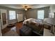 Cozy bedroom with hardwood floors, a quilt-covered bed, and ample natural light at 409 Azalea Dr, Walterboro, SC 29488