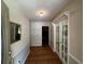 Inviting entryway featuring hardwood floors, elegant doors, and neutral walls at 409 Azalea Dr, Walterboro, SC 29488