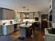 Beautiful kitchen with stone countertops, stainless steel appliances, kitchen island and hardwood floors at 409 Azalea Dr, Walterboro, SC 29488