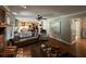 Bright living room with a view into the kitchen, featuring hardwood floors and comfortable seating at 409 Azalea Dr, Walterboro, SC 29488