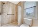 Shower and toilet in bathroom with bright, natural lighting at 4636 Ashley View Ln, North Charleston, SC 29405