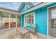 Charming deck area featuring cozy seating and access to a screened porch, perfect for outdoor relaxation at 4636 Ashley View Ln, North Charleston, SC 29405