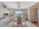Cozy dining area with a glass table and wicker chairs, filled with lots of natural light at 4636 Ashley View Ln, North Charleston, SC 29405