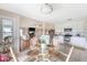 Bright dining area with a glass table that connects to the kitchen and living room at 4636 Ashley View Ln, North Charleston, SC 29405