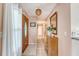 Inviting foyer featuring light colored walls, tile flooring, and a wood door with decorative glass at 4636 Ashley View Ln, North Charleston, SC 29405
