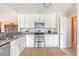 Bright kitchen featuring white cabinets, stainless steel appliances, and grey countertops at 4636 Ashley View Ln, North Charleston, SC 29405