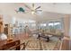 Bright and airy living room featuring hardwood floors, comfortable seating, and open flow to kitchen at 4636 Ashley View Ln, North Charleston, SC 29405