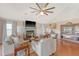 Open-concept living room showcasing a fireplace, vaulted ceilings, and views of the kitchen at 4636 Ashley View Ln, North Charleston, SC 29405