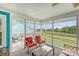 Relaxing screened porch with wicker furniture and marsh views at 4636 Ashley View Ln, North Charleston, SC 29405