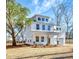 Inviting new construction with covered porch, brick accents, and attached garage at 518 Fleming Rd, Charleston, SC 29412