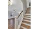 Staircase leading to the second floor with wood treads and white risers at 518 Fleming Rd, Charleston, SC 29412