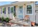 Welcoming front porch with stylish door and shutters, adding charm and character to the home's facade at 5904 Oak Street, Hanahan, SC 29410