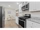 Modern kitchen featuring stainless steel appliances, sleek countertops, and ample storage space at 5904 Oak Street, Hanahan, SC 29410