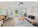 Stylish living room with modern decor, a comfortable couch, and natural light streaming through the windows at 5904 Oak Street, Hanahan, SC 29410