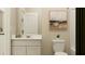 Clean bathroom featuring a white vanity, toilet, and minimalist decor at 620 Culpepper St, Summerville, SC 29486