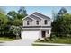Charming two-story home featuring a white garage door, and beautifully landscaped front yard at 620 Culpepper St, Summerville, SC 29486