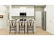 Modern kitchen featuring white cabinetry, an island with seating, and stainless steel appliances at 620 Culpepper St, Summerville, SC 29486