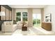 Inviting living room with a sectional sofa, large windows, and neutral decor at 620 Culpepper St, Summerville, SC 29486