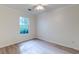 Neutral bedroom with light colored laminate flooring and a window at 6275 Rolling Fork Rd # 401, North Charleston, SC 29406
