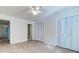 Bright bedroom with light colored laminate flooring, large closets, and neutral paint at 6275 Rolling Fork Rd # 401, North Charleston, SC 29406