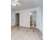 Bedroom featuring light colored flooring, an open doorway to a bath, and ample lighting at 6275 Rolling Fork Rd # 401, North Charleston, SC 29406