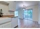 Kitchen connected to living room provides plenty of cabinet space and stainless steel dishwasher at 6275 Rolling Fork Rd # 401, North Charleston, SC 29406