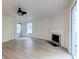 Inviting living room with a fireplace, ceiling fan, and sliding door to a screened-in porch at 6275 Rolling Fork Rd # 401, North Charleston, SC 29406