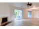 Bright living room features fireplace, wood floors, and access to a screened deck at 6275 Rolling Fork Rd # 401, North Charleston, SC 29406