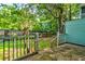 Backyard featuring a wood fence and mature trees at 6280 Rolling Fork Rd # 302, North Charleston, SC 29406