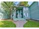 Inviting exterior view of the home featuring a charming entryway and well-maintained lawn at 6280 Rolling Fork Rd # 302, North Charleston, SC 29406