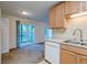 View of kitchen with an open design and sliding door access to outdoor space at 6280 Rolling Fork Rd # 302, North Charleston, SC 29406