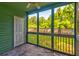 Enclosed porch featuring screened windows offering view of the backyard at 6280 Rolling Fork Rd # 302, North Charleston, SC 29406
