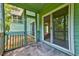 Enclosed porch featuring screened windows and access to the backyard at 6280 Rolling Fork Rd # 302, North Charleston, SC 29406