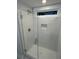 Contemporary glass shower featuring white subway tile and convenient built-in niche and window at 641 Magnolia Rd, Charleston, SC 29407