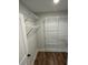 Spacious walk-in closet with custom shelving and wooden floors at 641 Magnolia Rd, Charleston, SC 29407