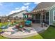 Outdoor living area featuring comfortable seating, a pergola, and a view of the well-manicured lawn at 658 Yellow Leaf Ln, Summerville, SC 29486