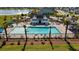 Community pool with palm trees, lounge chairs, and cabana, offering a resort-like experience at 658 Yellow Leaf Ln, Summerville, SC 29486