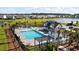 Community pool area with palm trees, lounge chairs and playground, perfect for Gathering fun at 658 Yellow Leaf Ln, Summerville, SC 29486