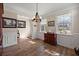 Traditional dining room featuring wood floors, panel molding, and chandelier at 658 Yellow Leaf Ln, Summerville, SC 29486